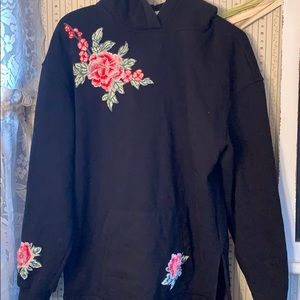 Black hoodie with rose appliqués